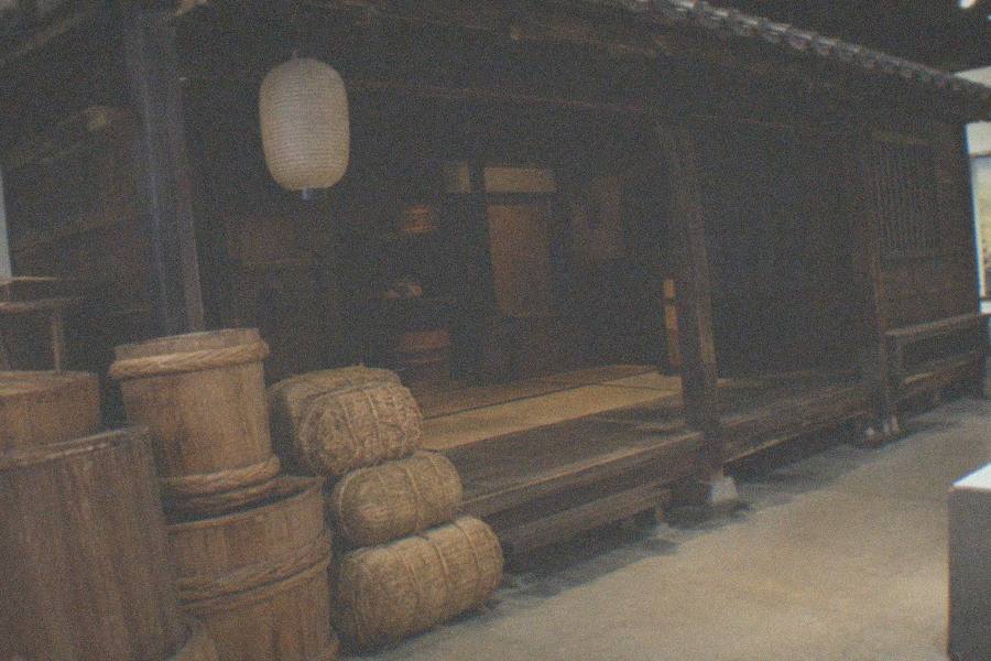 Visitors walking through a recreated Edo-period streetscape inside the Edo-Tokyo Museum in Sumida
