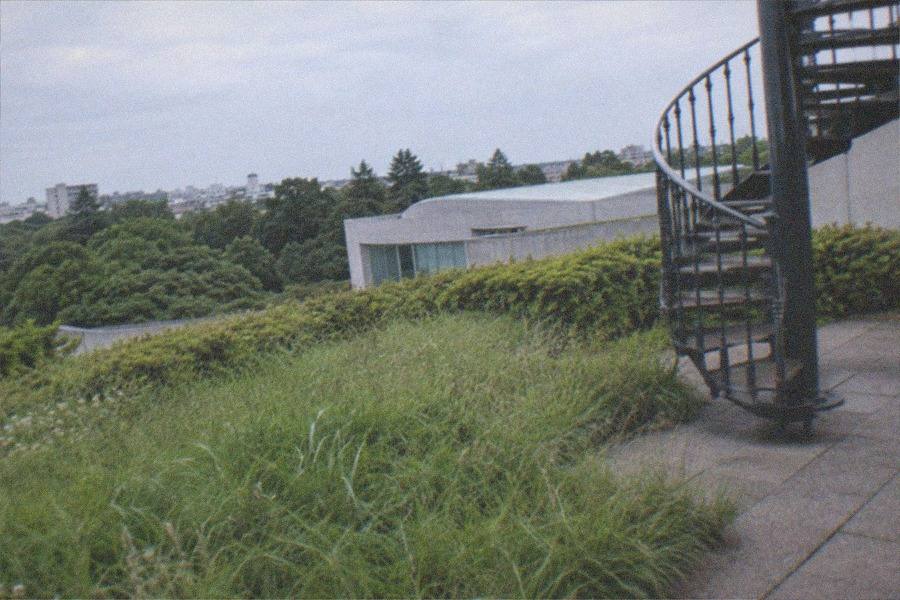 The whimsically designed Ghibli Museum, Mitaka building seen from its garden path in Inokashira Park