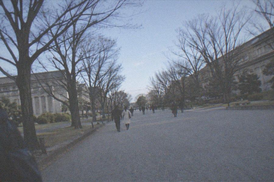 A ticket counter at a Tokyo national museum with a short line of visitors