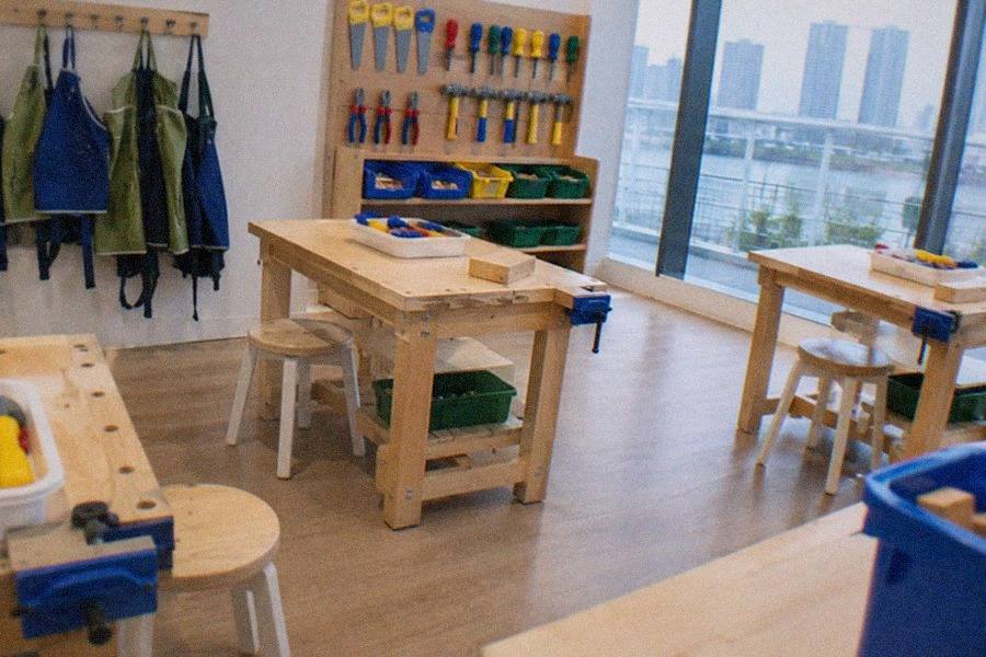 KidZania Tokyo's scaled-down city street with children walking between branded job pavilions