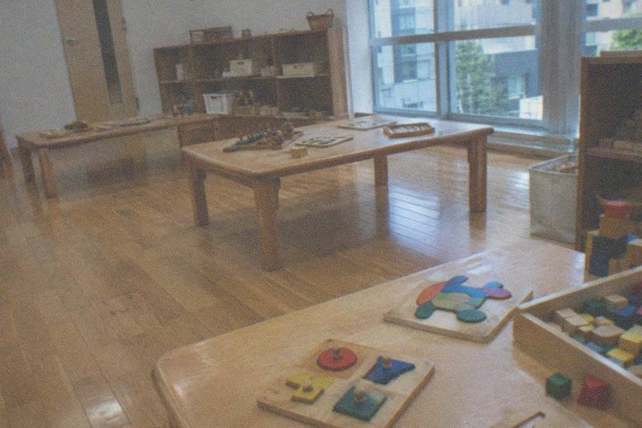 Children playing with wooden toys in a hands-on room at the Tokyo Toy Museum in Yotsuya